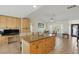 Open floorplan with kitchen island and lots of cabinet space at 10616 Ayear Rd, Port Charlotte, FL 33981