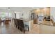 Bright kitchen featuring granite counters, island, and tile floors at 10616 Ayear Rd, Port Charlotte, FL 33981