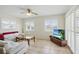Inviting living room with tile floors and plantation shutters at 10616 Ayear Rd, Port Charlotte, FL 33981
