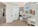 This bedroom has neutral walls, a walk-in closet, and a study area next to the window for maximum productivity at 11435 Apple Tree Cir, Bradenton, FL 34211