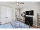 Contemporary bedroom featuring a dark dresser, metal bed frame, and decoratively displayed baseball caps at 11435 Apple Tree Cir, Bradenton, FL 34211