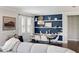 Stylish dining room with a modern table setting and a unique blue accent wall with decorative shelving at 11435 Apple Tree Cir, Bradenton, FL 34211