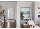 Inviting entryway featuring a staircase, elegant decor, and a view of the front door, creating a warm welcome at 11435 Apple Tree Cir, Bradenton, FL 34211