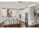 Modern kitchen with white cabinetry, stainless steel appliances, and a spacious kitchen island at 11435 Apple Tree Cir, Bradenton, FL 34211