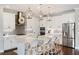 Gourmet kitchen with stainless appliances, white cabinets, and center island at 11435 Apple Tree Cir, Bradenton, FL 34211