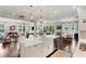 Open-concept kitchen overlooking the living room and dining area at 11435 Apple Tree Cir, Bradenton, FL 34211