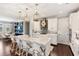 Well-appointed kitchen with stainless appliances, white cabinets, and an island with seating at 11435 Apple Tree Cir, Bradenton, FL 34211