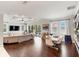 Spacious living room featuring hardwood floors, coffered ceiling, and a view of the backyard at 11435 Apple Tree Cir, Bradenton, FL 34211