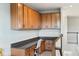 A great workspace featuring upper cabinets and a built-in desk with stair access at 11435 Apple Tree Cir, Bradenton, FL 34211