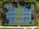 Aerial shot of two pickleball courts offering a recreational amenity surrounded by lush landscaping in the community at 11435 Apple Tree Cir, Bradenton, FL 34211