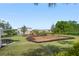Community playground with swings and slides on a sunny day at 11435 Apple Tree Cir, Bradenton, FL 34211