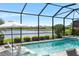 Enjoy the pool and spa with picturesque lake views from this screened-in backyard retreat at 11435 Apple Tree Cir, Bradenton, FL 34211