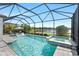 Enjoy the pool and spa with picturesque lake views from this screened-in backyard retreat at 11435 Apple Tree Cir, Bradenton, FL 34211