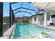 A refreshing pool and spa are enclosed in a screened lanai for endless outdoor enjoyment at 11435 Apple Tree Cir, Bradenton, FL 34211