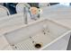 The kitchen features a farmhouse sink and marbled countertops at 11435 Apple Tree Cir, Bradenton, FL 34211
