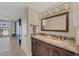 Bathroom featuring granite countertop vanity, double sinks, and contemporary lighting at 1212 Benjamin Franklin Dr # 708, Sarasota, FL 34236