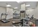 Bright gym with modern exercise equipment, including treadmills and weight machines, for a full-body workout at 1212 Benjamin Franklin Dr # 708, Sarasota, FL 34236