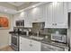 This kitchen offers modern appliances, granite countertops, and abundant storage at 1212 Benjamin Franklin Dr # 708, Sarasota, FL 34236