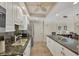A well-equipped kitchen featuring stainless steel appliances and stylish granite countertops at 1212 Benjamin Franklin Dr # 708, Sarasota, FL 34236