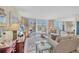 Spacious living room with balcony access, ocean view, and comfortable seating at 1212 Benjamin Franklin Dr # 708, Sarasota, FL 34236
