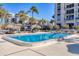 The beautiful pool with swaying palm trees, offers a peaceful place to unwind, cool off, and soak in the Florida sun at 1212 Benjamin Franklin Dr # 708, Sarasota, FL 34236