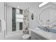 Charming bathroom with modern vanity, shower-tub combination, and decorative mirror at 12305 Harland St, North Port, FL 34287