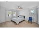 Comfortable bedroom features light-colored floor, natural light, and ceiling fan at 12305 Harland St, North Port, FL 34287