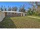 A single-story brick home displaying the well-maintained lawn and manicured landscape, capturing the home's charm at 12305 Harland St, North Port, FL 34287