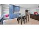 Open-concept layout showcasing the kitchen, dining area, and cozy living space with stylish blue accents and decor at 12305 Harland St, North Port, FL 34287
