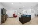 Bright living room with modern furniture, light wood floors, and plenty of natural light at 12305 Harland St, North Port, FL 34287