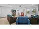 Spacious living room featuring modern furniture, light-colored floors and plenty of natural light at 12305 Harland St, North Port, FL 34287