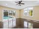 This bedroom features a ceiling fan, and access to the pool area at 1248 Northport Dr, Sarasota, FL 34242