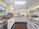 Updated kitchen features granite countertops, stainless steel appliances, and lots of natural light at 1248 Northport Dr, Sarasota, FL 34242