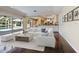 Bright living room with open floor plan, seamless access to screened pool, and modern furnishings at 1248 Northport Dr, Sarasota, FL 34242