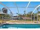 Beautiful waterfront view from the screened-in pool area, with boats docked nearby at 1248 Northport Dr, Sarasota, FL 34242