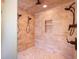 Walk-in shower features dual shower heads, tiled walls, tiled flooring, and a built-in shelf at 1248 Northport Dr, Sarasota, FL 34242