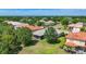 An elevated perspective reveals a home enveloped by lush lawns and mature trees at 12628 Daisy Pl, Bradenton, FL 34212