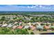 An elevated perspective reveals homes nestled in a lush area of ponds, trees and green spaces at 12628 Daisy Pl, Bradenton, FL 34212