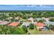 Beautiful aerial view of homes with lush landscaping, and orange and green roof tiles at 12628 Daisy Pl, Bradenton, FL 34212