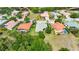 A beautiful aerial view of the home nestled amongst well maintained homes and manicured lawns at 12628 Daisy Pl, Bradenton, FL 34212