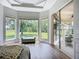 Cozy bedroom seating area with large windows overlooking a lush green lawn at 12628 Daisy Pl, Bradenton, FL 34212