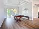 Spacious game room with pool table, tray ceiling and sliding doors to an outdoor patio at 12628 Daisy Pl, Bradenton, FL 34212