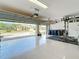A very clean and organized garage with high ceilings and epoxy flooring at 12628 Daisy Pl, Bradenton, FL 34212