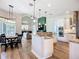 Well-equipped kitchen with a central island, breakfast bar, and modern appliances at 12628 Daisy Pl, Bradenton, FL 34212