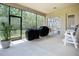 Spacious screened lanai with two grills overlooking a lush green lawn at 12628 Daisy Pl, Bradenton, FL 34212