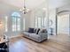 Comfortable living room featuring hardwood floors and ample natural light at 12628 Daisy Pl, Bradenton, FL 34212