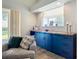 Comfortable living room with a custom-built blue cabinet with wood countertop, enhancing the room's decor at 12628 Daisy Pl, Bradenton, FL 34212