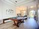 View of the game room leading to an open living space and foyer at 12628 Daisy Pl, Bradenton, FL 34212