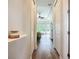 Hallway view into the main bedroom with tray ceilings and large windows at 12628 Daisy Pl, Bradenton, FL 34212