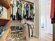 Spacious walk-in closet with custom shelves, rods, and a view into the light-filled bedroom at 12628 Daisy Pl, Bradenton, FL 34212